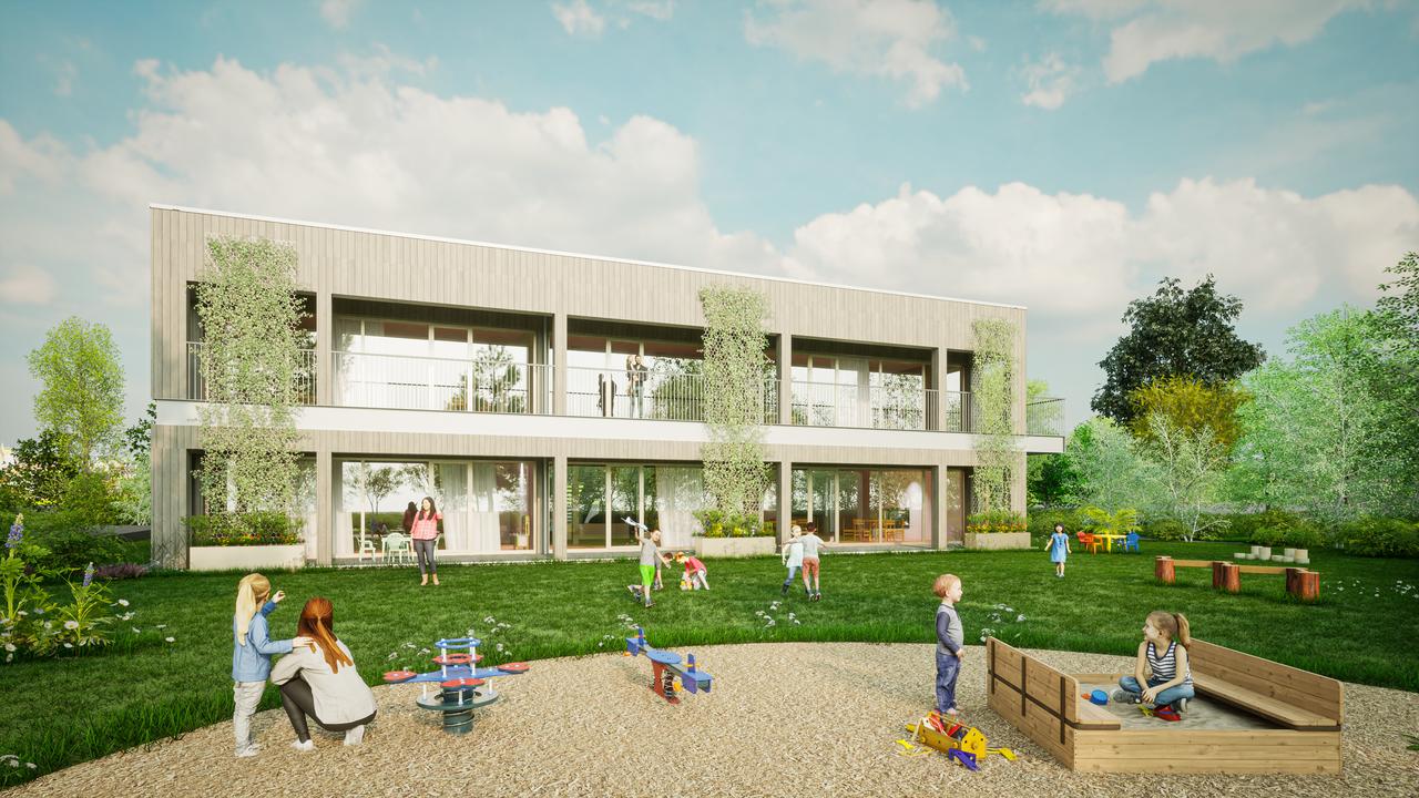 Architekturzeichnung eines zweistöckigen Gebäudes mit Garten im Vordergrund, das als Kindergarten in der Stadtgemeinde Ternitz errichtet wird